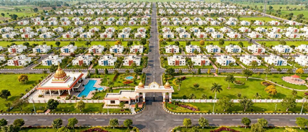 Kutumb City premium residential township in Haridwar with modern gated community architecture, landscaped parks, clubhouse, swimming pool, and 24/7 security